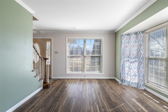 empty room with ornamental molding and dark hardwood / wood-style floors