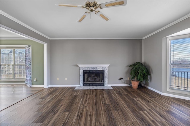 unfurnished living room featuring a healthy amount of sunlight, a fireplace, and dark hardwood / wood-style flooring