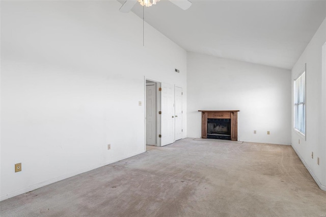 unfurnished living room with ceiling fan, light colored carpet, and high vaulted ceiling