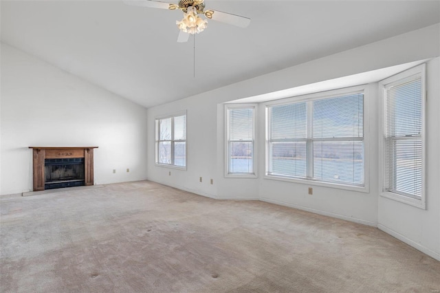 unfurnished living room with light carpet, vaulted ceiling, and ceiling fan