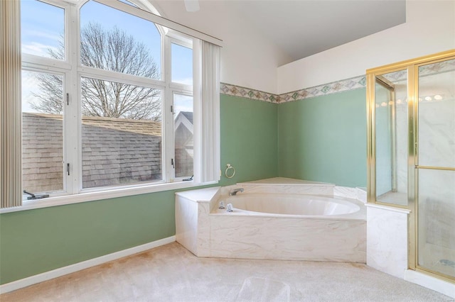 bathroom featuring a bathtub and vaulted ceiling