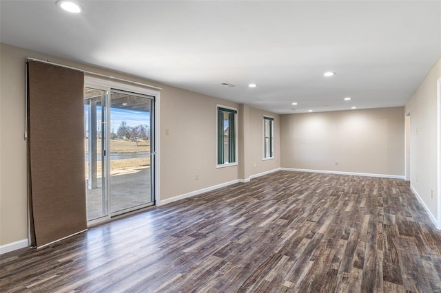 empty room featuring dark hardwood / wood-style flooring