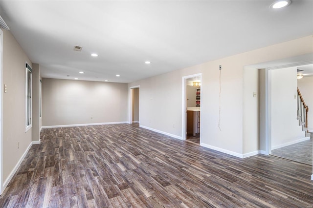 empty room with dark hardwood / wood-style floors