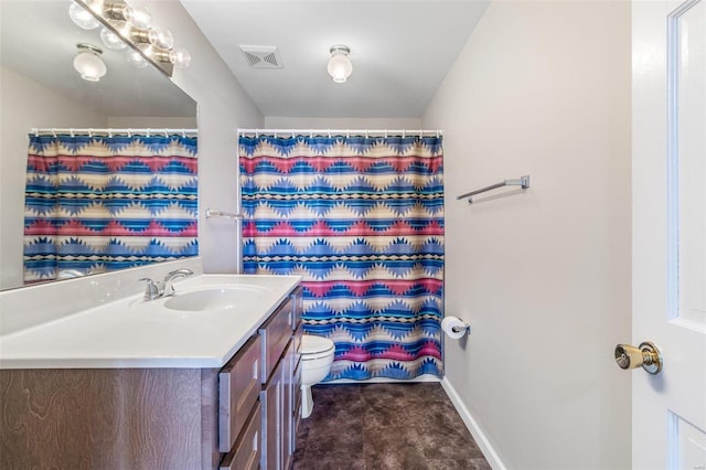 bathroom with vanity, toilet, and a shower with shower curtain