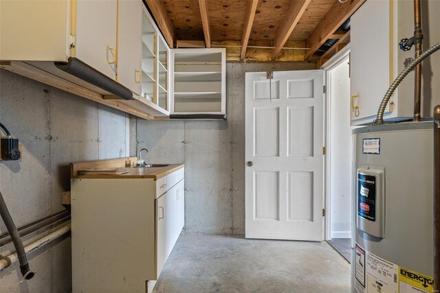 basement with water heater and sink