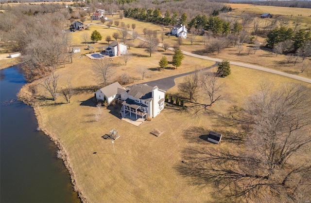 birds eye view of property featuring a rural view and a water view