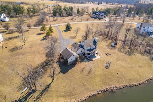 bird's eye view with a water view and a rural view