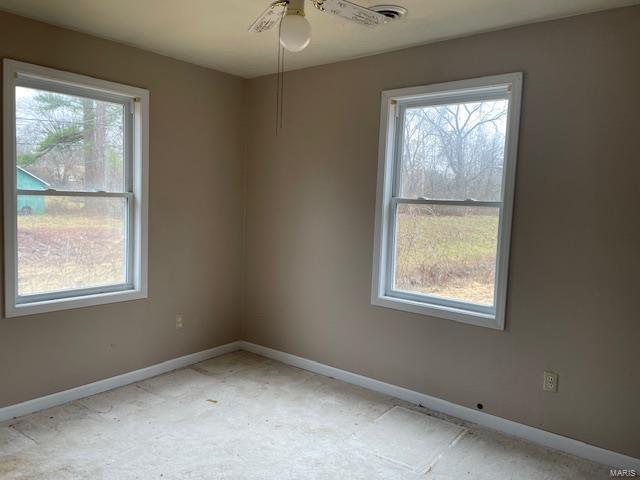 spare room with ceiling fan