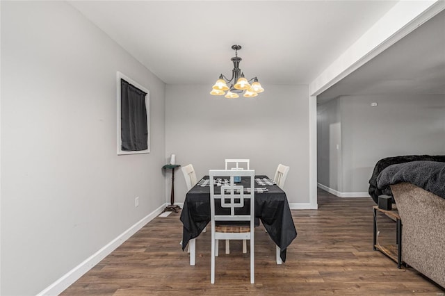 dining room with an inviting chandelier and dark hardwood / wood-style floors