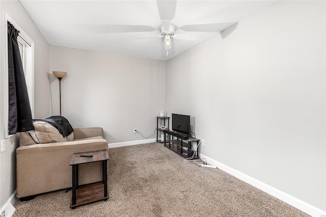 living room featuring carpet flooring and ceiling fan