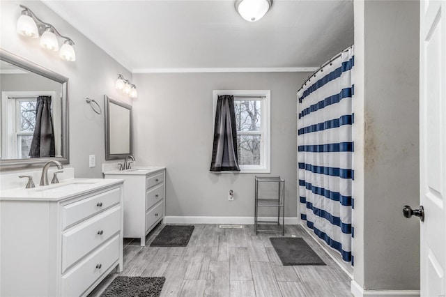 bathroom featuring vanity, curtained shower, and a wealth of natural light