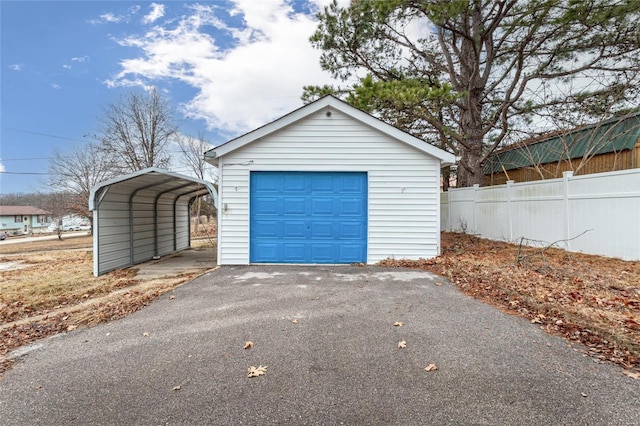 garage featuring a carport