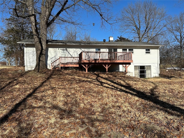 back of property featuring a deck