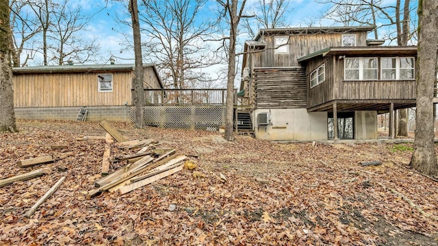 view of home's exterior featuring a wooden deck