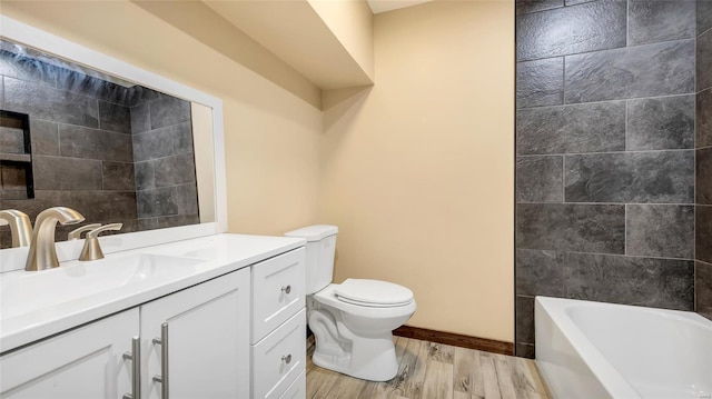 bathroom featuring hardwood / wood-style flooring, vanity, and toilet