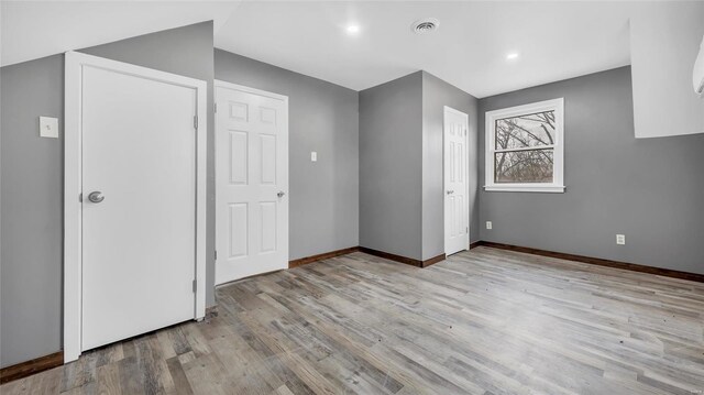 unfurnished bedroom featuring light hardwood / wood-style floors