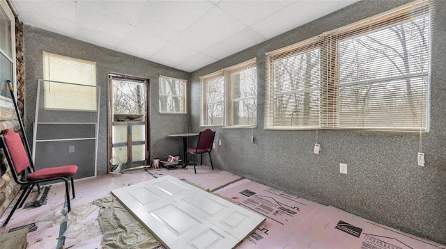 sunroom / solarium with a paneled ceiling