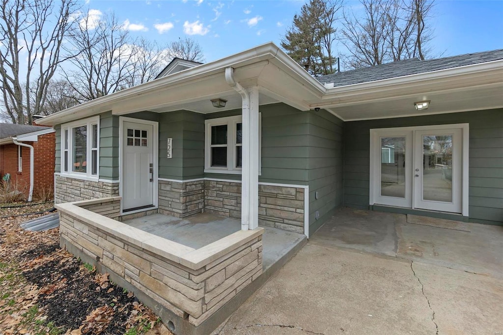 entrance to property featuring french doors