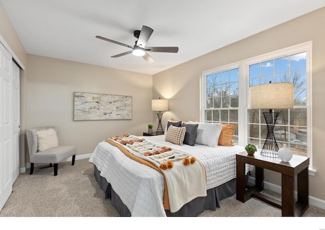 bedroom with light carpet, a closet, and ceiling fan