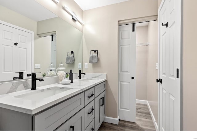 bathroom featuring vanity and wood-type flooring