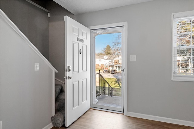 doorway with light wood-type flooring