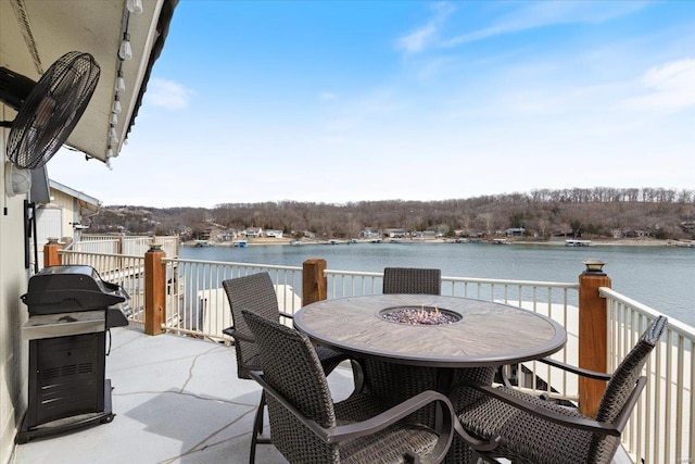 view of patio / terrace with a water view and outdoor dining space