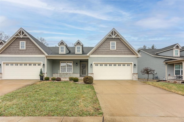 craftsman-style house with covered porch and a front lawn