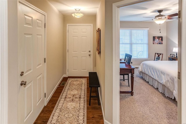 interior space with dark hardwood / wood-style floors and ceiling fan