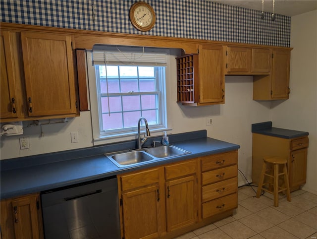 kitchen with dishwasher, sink, and light tile patterned floors