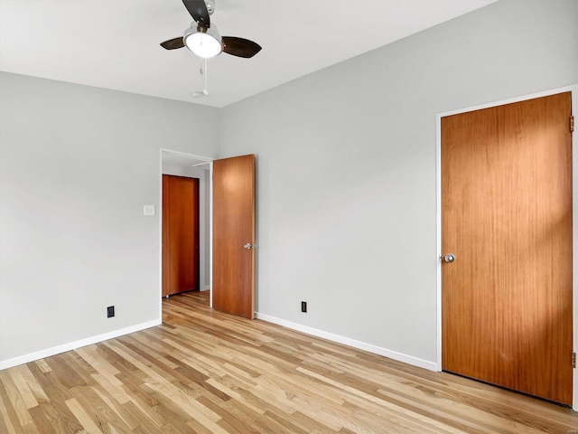 unfurnished bedroom featuring light hardwood / wood-style flooring and ceiling fan