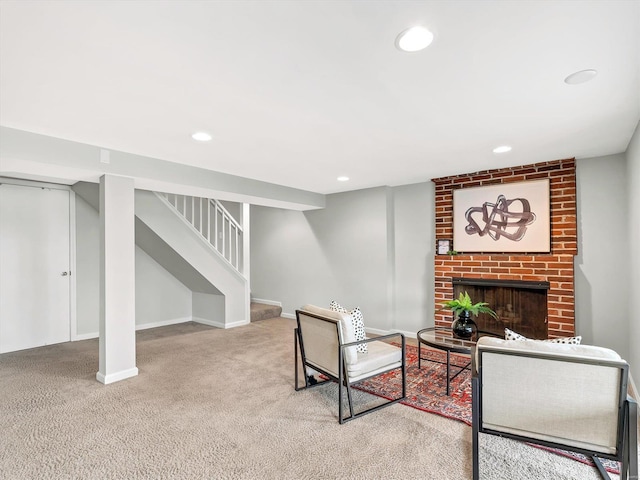 carpeted living room featuring a brick fireplace