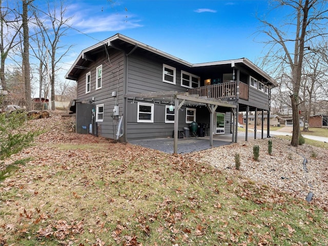 rear view of property with a patio area