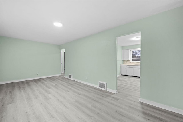 empty room featuring light hardwood / wood-style floors