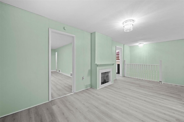 unfurnished living room featuring light wood-type flooring