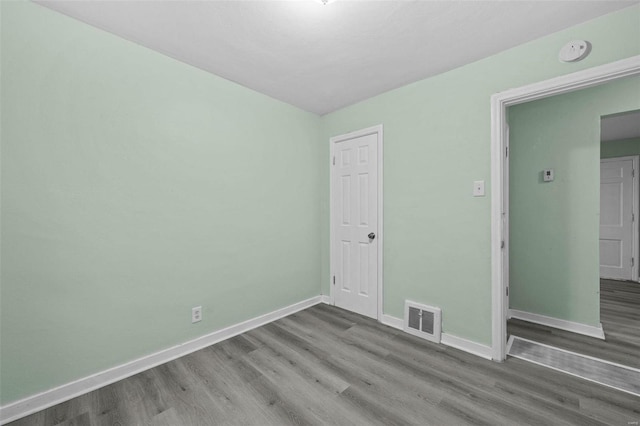 spare room featuring light wood-type flooring