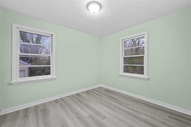 unfurnished room featuring light wood-type flooring