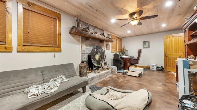 living room featuring ceiling fan, concrete flooring, a brick fireplace, and wooden ceiling