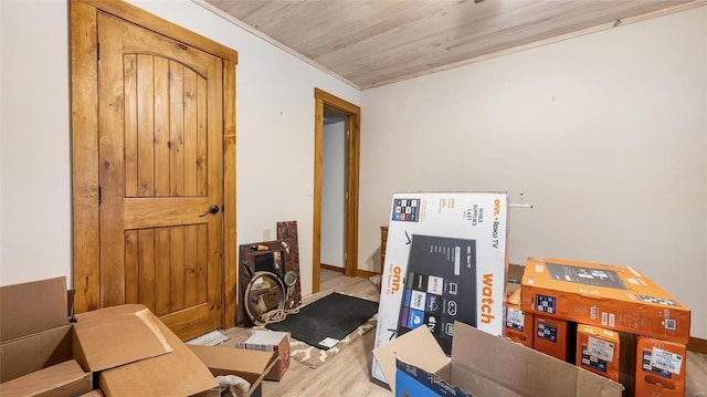 interior space with wood ceiling and light hardwood / wood-style floors