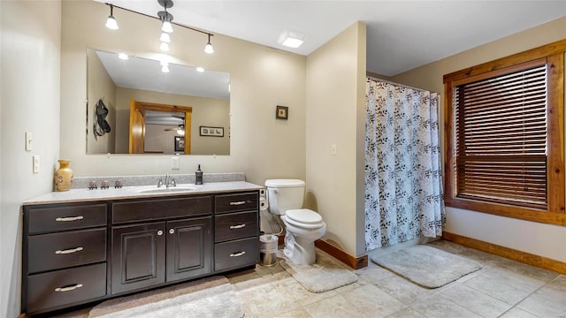 bathroom with ceiling fan, vanity, and toilet