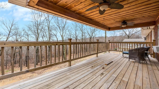 wooden deck featuring ceiling fan