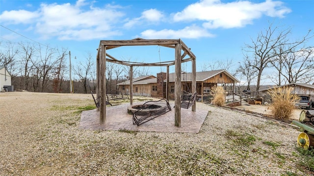 view of yard featuring a patio area and a fire pit