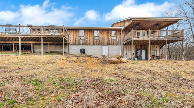 rear view of property with a wooden deck