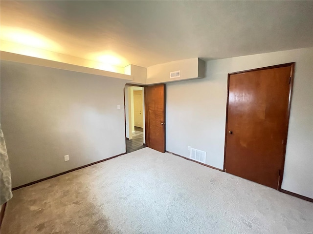 unfurnished bedroom featuring a closet and carpet