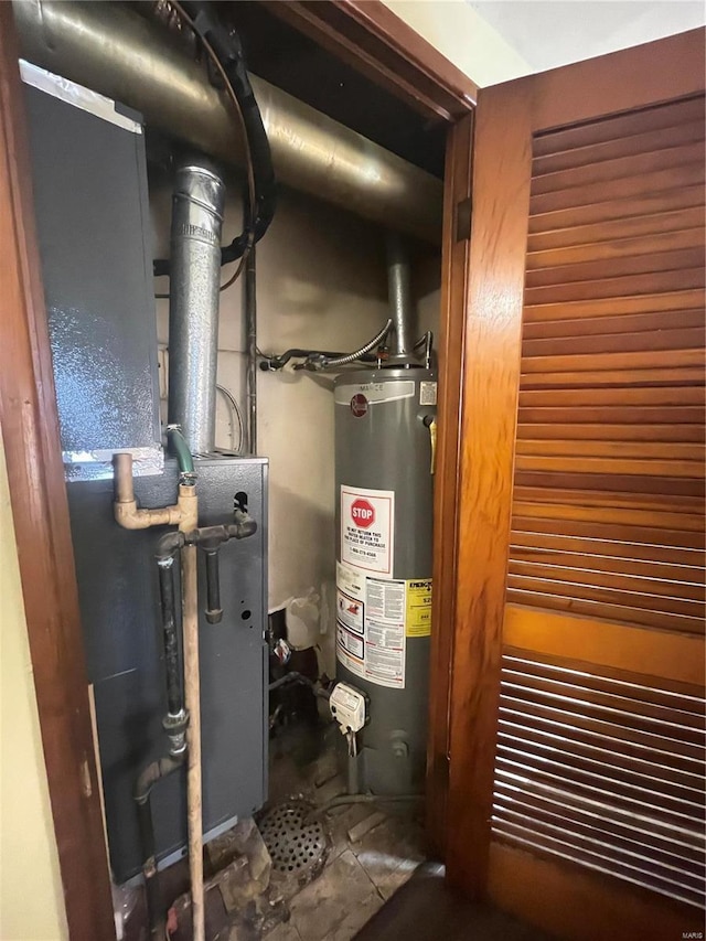 utility room featuring water heater