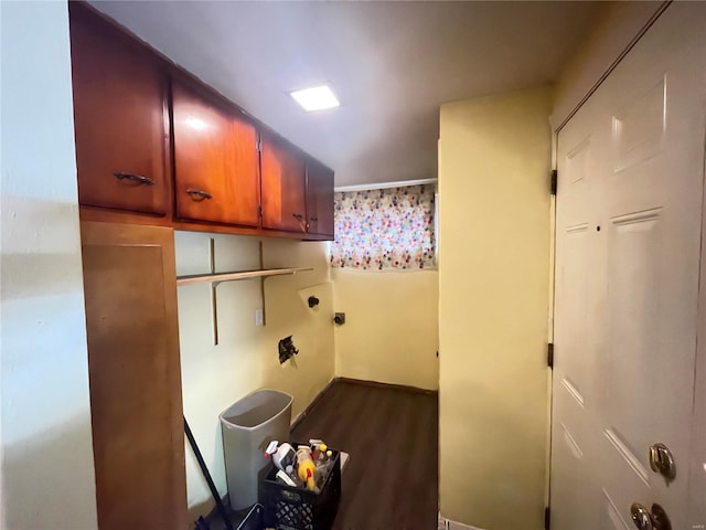 laundry room with cabinets and dark hardwood / wood-style flooring