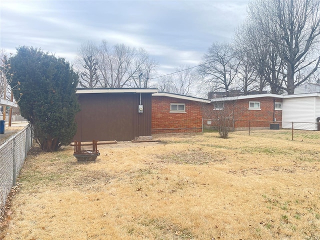 rear view of property with a lawn