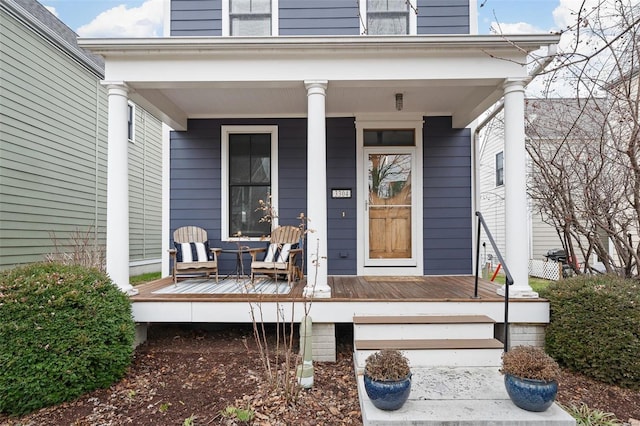 doorway to property featuring covered porch