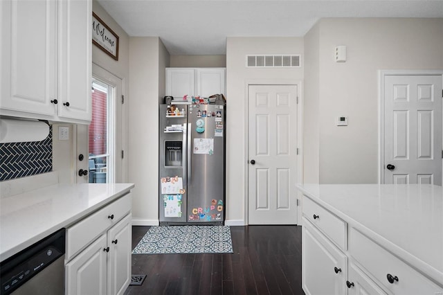 kitchen with appliances with stainless steel finishes, dark hardwood / wood-style floors, and white cabinets