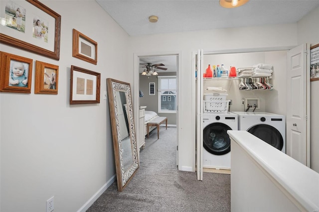 clothes washing area featuring dark carpet, washer and dryer, and a textured ceiling