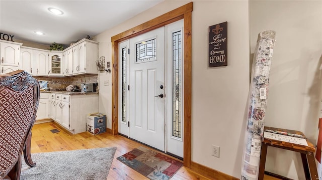 foyer entrance featuring light wood-type flooring